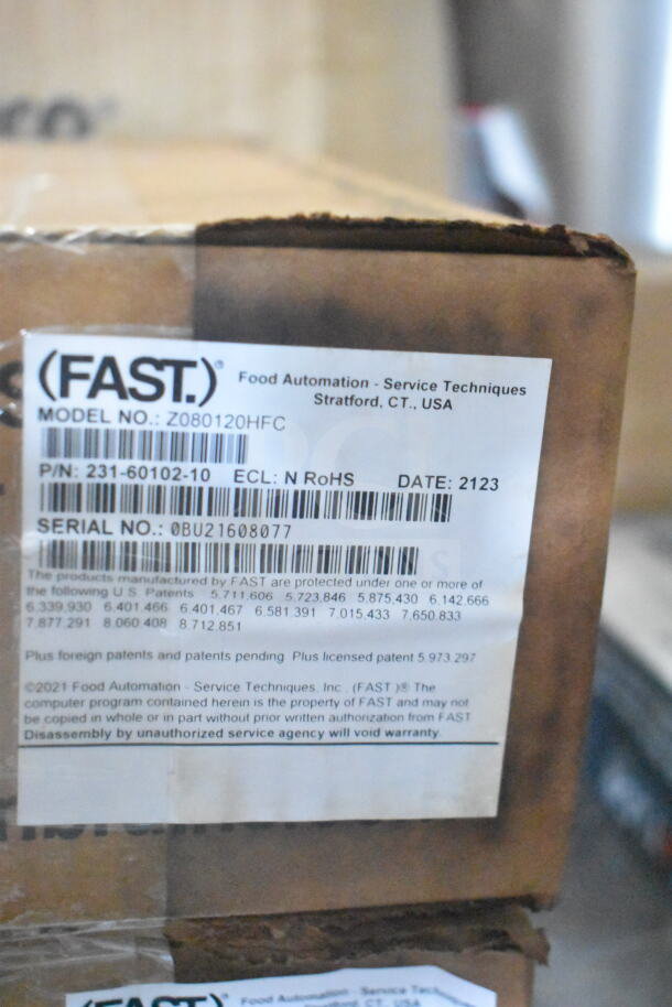 Label showing FAST, Model Z080120HFC, serial 0BU21608077. Patents listed, caution note: "Disassembly voids warranty."