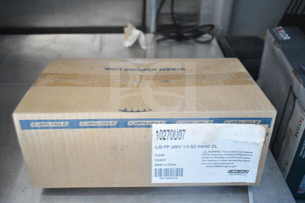 Cardboard box with Carlisle branding. Label reads "LID FP UNIV 1/3 SZ HAND CL, Made in China." Contains 6 items.
