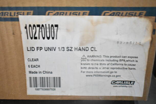 Box with "Carlisle" branding, labeled 10270U007, contains 6 clear lids, made in China, with chemical exposure warning.