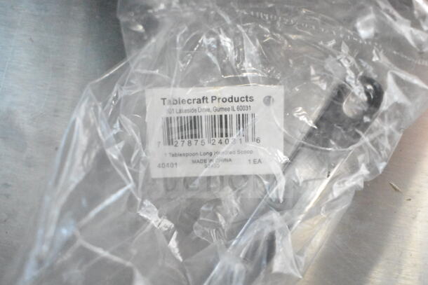 Plastic-wrapped Tablecraft Products tablespoon scoop, label shows made in China, model 40401.