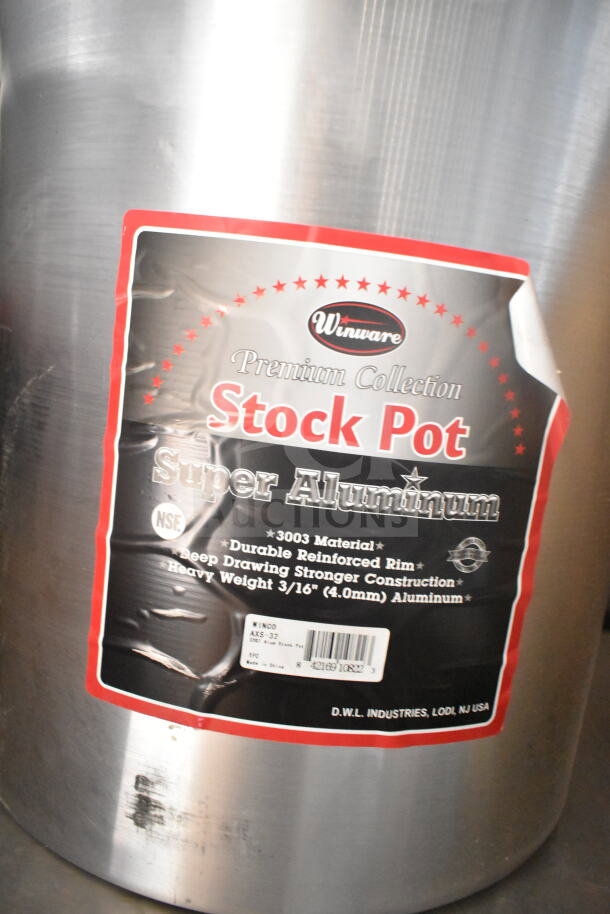 Alt text: Winware stock pot label indicating premium aluminum 3003 material, reinforced rim, and durable construction. NSF certified.
