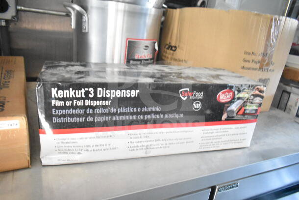 Kenkut 3 Dispenser box for film or foil on a countertop, Safer Food Solutions branding visible.