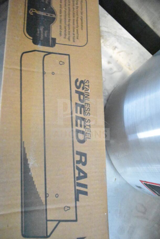 Cardboard packaging for stainless steel speed rail, semi-visible next to a metal surface.