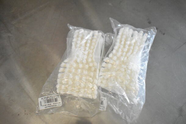 Packaged white brushes for food trailer cleaning, labeled for model 2021 Rock Solid Cargo 8.5'x24'.