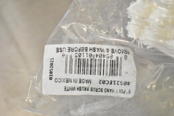 Clear plastic packaging with a label indicating "6.7 Poly Hand Scrub Brush White, Made in Mexico."