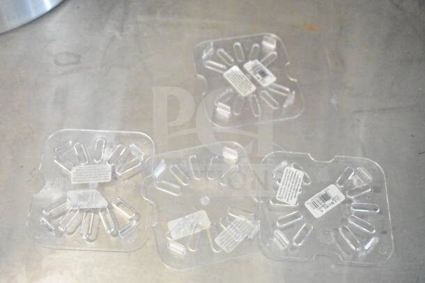 Clear plastic vent covers with warning labels and barcodes. Text on labels is visible but not legible.