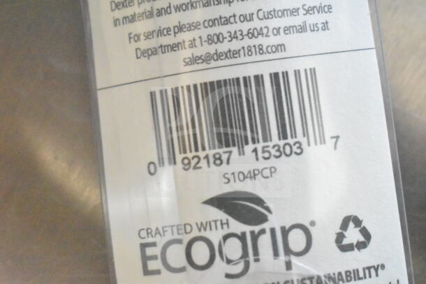 "Close-up of barcode and text on a product label, featuring 'Crafted with Ecogrip' and recycling symbol."