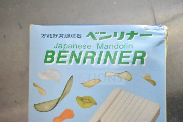 Japanese mandolin slicer packaging labeled "Benriner," featuring vegetable slices and text in Japanese and English.