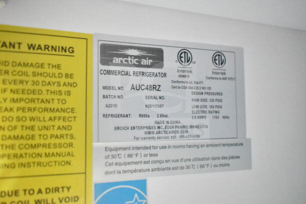 Arctic Air AUC48RZ commercial refrigerator label, showing model, serial, refrigerant details, and usage instructions.