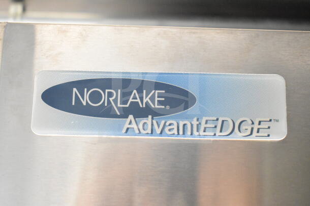 Label on Norlake AdvantEdge refrigeration unit inside 2021 Rock Solid Cargo 8.5'x24' food trailer.