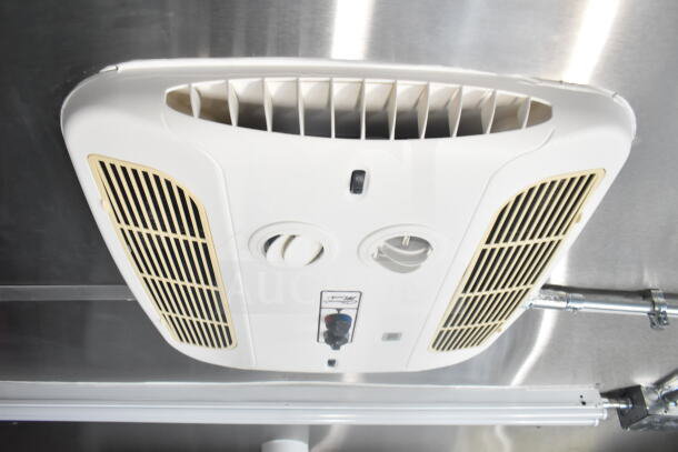 Ceiling ventilation unit inside a 2021 Rock Solid Cargo food trailer, featuring control knobs and air vents.