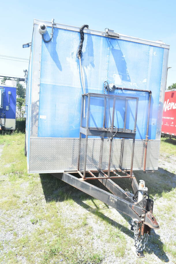2021 Rock Solid Cargo 8.5'x24' food trailer, blue exterior, featuring CaptiveAire grease hood. VIN: 7H2BE2426MD037994.