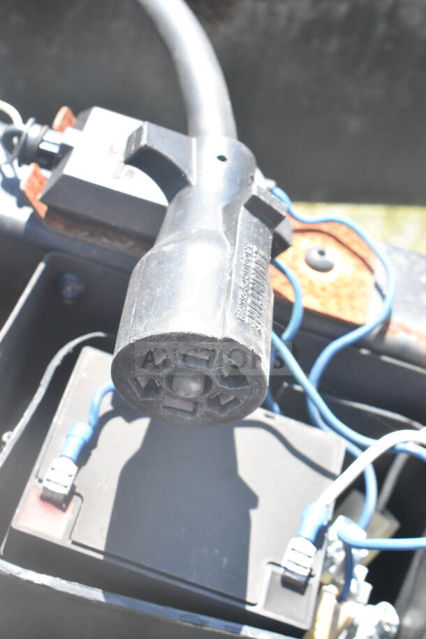 Close-up view of a wiring connection on a 2021 Rock Solid Cargo food trailer, model details not visible.