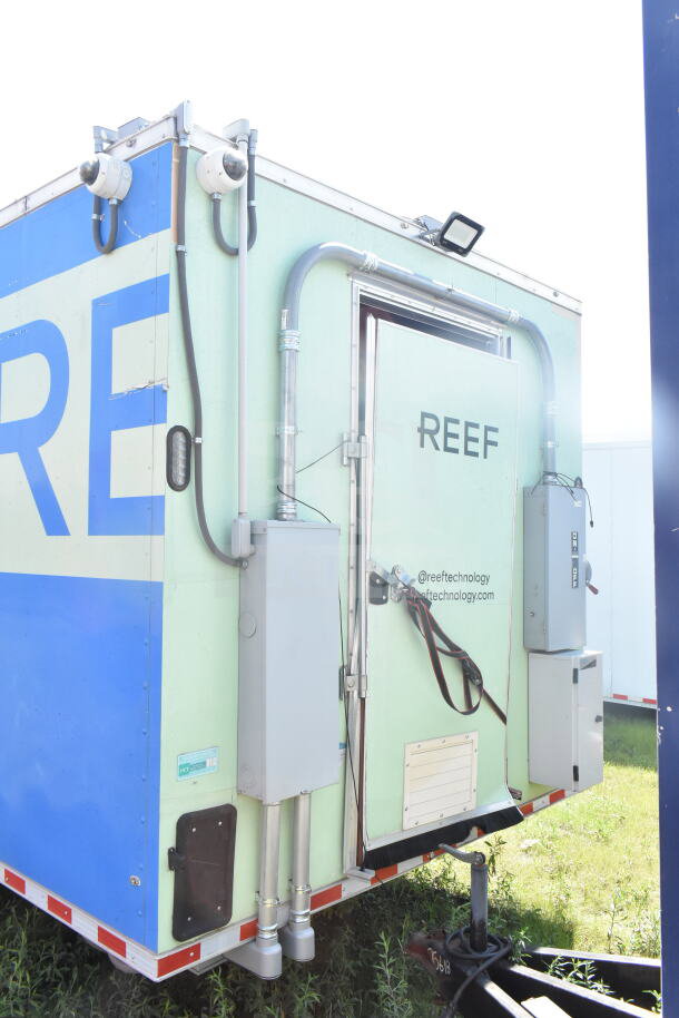 2021 Rock Solid Cargo 8.5'x24' food trailer, equipped with CaptiveAire hood and fire suppression, visible branding on door.