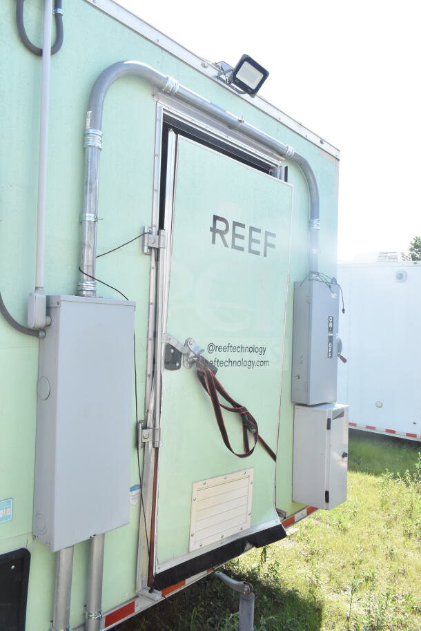 2021 Rock Solid Cargo 8.5'x24' food trailer, equipped with CaptiveAire grease hood, fire suppression, refrigeration, and Imperial gas fryers. Visible external conduit and "REEF" branding.