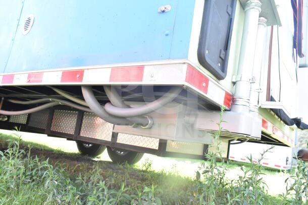 2021 Rock Solid Cargo 8.5'x24' food trailer underside view, showing piping and support structures.