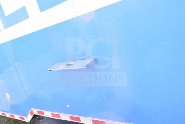 2021 Rock Solid Cargo 8.5'x24' blue food trailer exterior, side view with visible mount, sturdy construction.