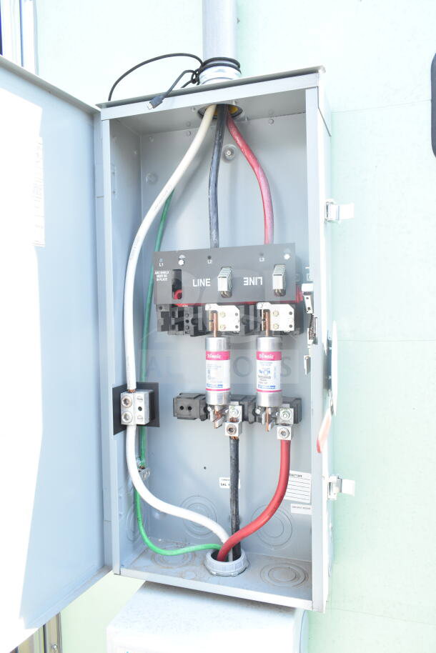 Open electrical panel inside 2021 Rock Solid Cargo food trailer, showing wiring and labeling for safe power management.