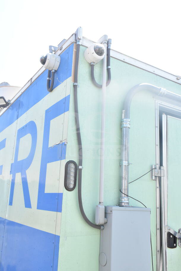 2021 Rock Solid Cargo 8.5'x24' food trailer with visible security cameras, sturdy build, CaptiveAire grease hood, VIN 7H2BE2426MD037994.