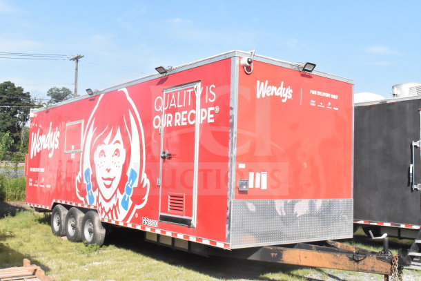 2021 Rock Solid Cargo 8.5'x28' food trailer with red Wendy's branding, dual axles, and exterior in good condition. VIN 7H2BE2831MD037369.