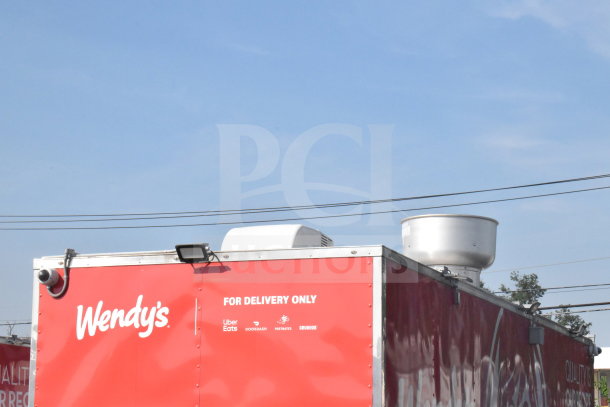 2021 Rock Solid Cargo 8.5'x28' food trailer, red with branding, delivery labels, visible roof equipment, VIN 7H2BE2831MD037369.