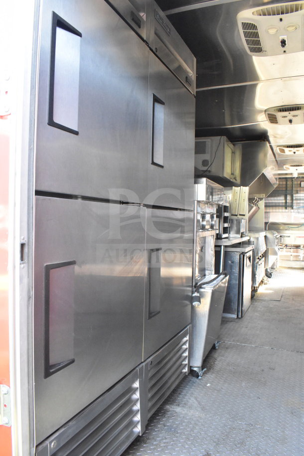 2021 Rock Solid Cargo 8.5'x28' food trailer interior with stainless steel equipment, visible ventilation, and clean flooring. VIN 7H2BE2831MD037369.