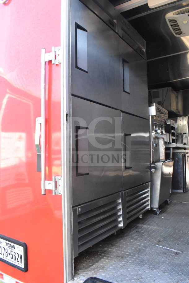 2021 Rock Solid Cargo 8.5'x28' food trailer, red exterior, with double-door refrigeration unit and stainless steel interior.