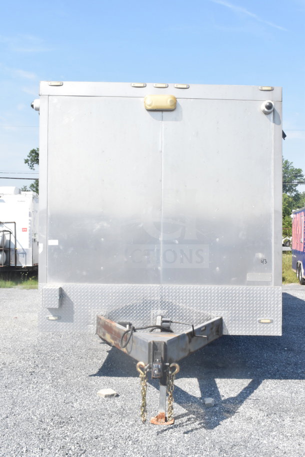 2021 Texino 8.5'x28' food trailer, silver exterior, visible hitch, diamond plate trim, and lighting fixtures; VIN 4B9T1EC36MM286017.