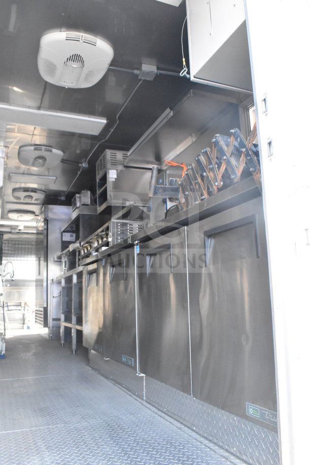 2021 Texino 8.5'x28' food trailer interior, featuring stainless steel counters, refrigeration, vents, and shelving. VIN 4B9T1EC36MM286017.