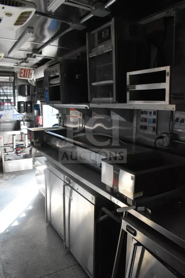 2021 Rock Solid Cargo 8.5'x28' food trailer with CaptiveAire hood, fire suppression, refrigeration, Taylor machines. VIN 7H2BE2831MD037369.