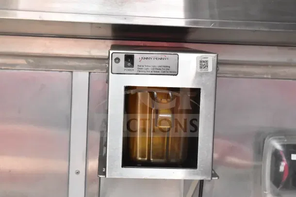 Henny Penny heating unit inside 2021 Rock Solid Cargo food trailer, showing control panel with power switch and status lights.