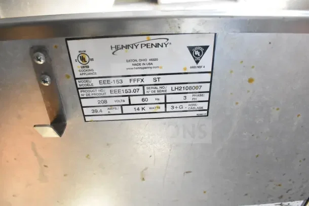 Label on commercial appliance showing Henny Penny model EEE-153, 208 volts, 60 Hz, 3 phase, serial LH2108007.