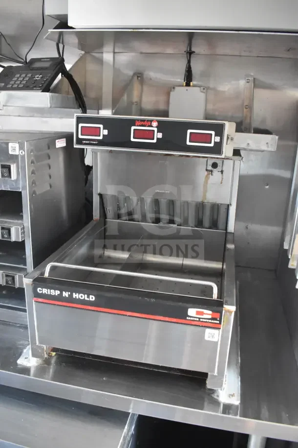 Carter-Hoffmann Crisp N’ Hold Unit in stainless steel food trailer, featuring digital controls and compartment dividers.