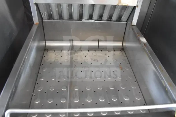 2021 Rock Solid Cargo food trailer interior, showing CaptiveAire hood. Stainless steel, visible wear.