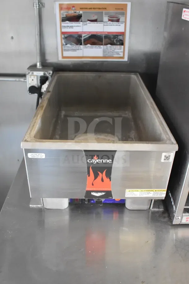 Cayenne Vollrath warming pan with labels, part of 2021 Rock Solid Cargo food trailer. Stainless steel construction.