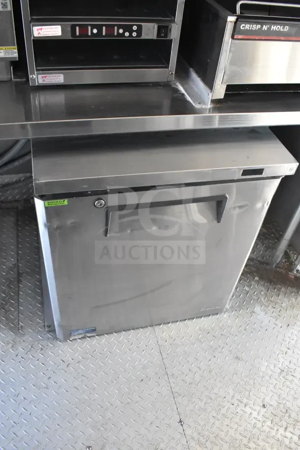2021 Rock Solid Cargo 8.5'x28' food trailer interior showing refrigeration unit and Crisp N' Hold warming drawer.