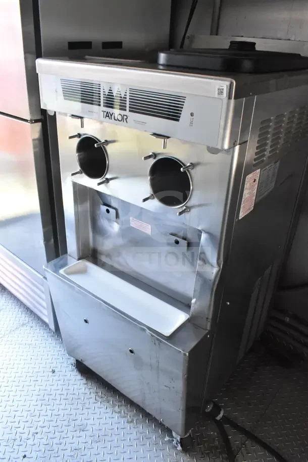 Taylor milkshake machine in a 2021 Rock Solid Cargo food trailer, featuring dual dispenser and stainless steel finish.