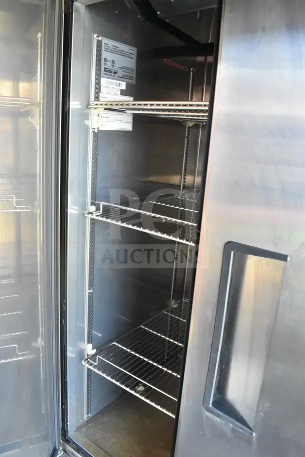 Interior view of refrigeration suite in 2021 Rock Solid Cargo food trailer, featuring Turbo Air shelving.