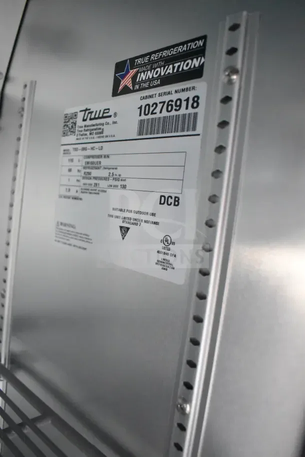 "True Refrigeration label on 2021 Rock Solid Cargo food trailer, showcasing specs for refrigeration unit model TRD-090-HC-LD; serial 10276918."