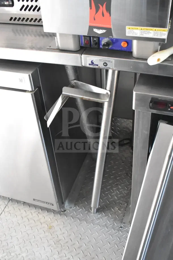 2021 Rock Solid Cargo 8.5'x28' food trailer interior with CaptiveAire hood, refrigeration suite, and Taylor appliances.