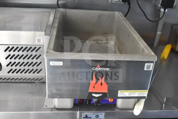 2021 Rock Solid Cargo 8.5'x28' food trailer interior with Cayenne Vollrath equipment, visible caution labels.