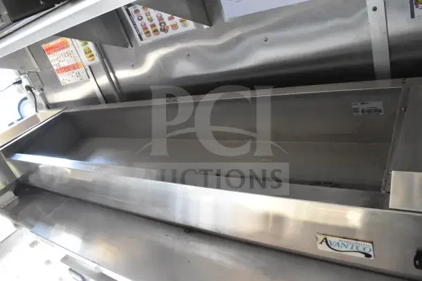 2021 Rock Solid Cargo 8.5'x28' food trailer interior, featuring an Avantco refrigeration unit. Stainless steel finish.