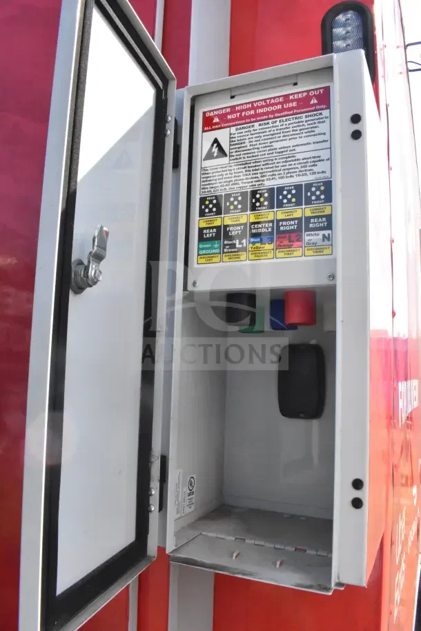Electrical panel of 2021 Rock Solid Cargo food trailer, showing high voltage warning and connection instructions.