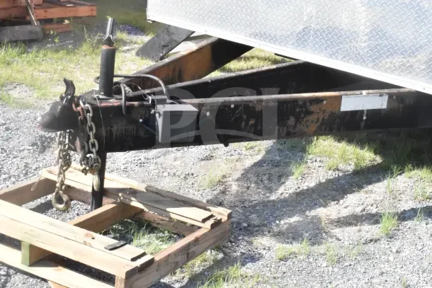 2021 Rock Solid Cargo 8.5'x28' food trailer hitch with visible chains and markings, includes VIN plate.