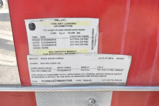 2021 Rock Solid Cargo 8.5'x28' food trailer label showing tire, loading info, GVWR 7031 kg, VIN 7H2BE2831MD037369.