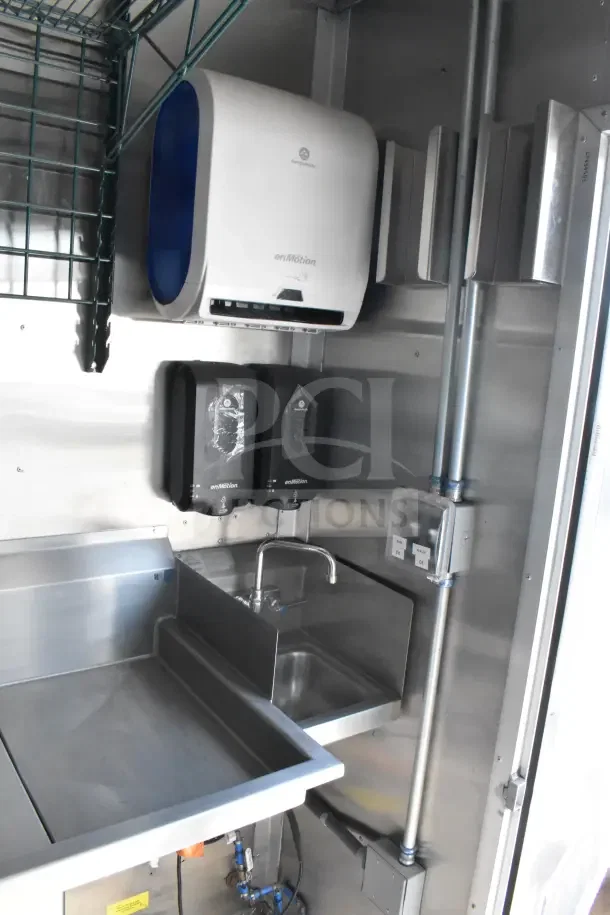 2021 Texino food trailer sink area with Georgia-Pacific enMotion dispensers and stainless steel counter.