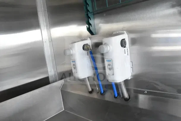 2021 Texino food trailer interior, featuring Ecolab liquid soap dispensers. Stainless steel surfaces.
