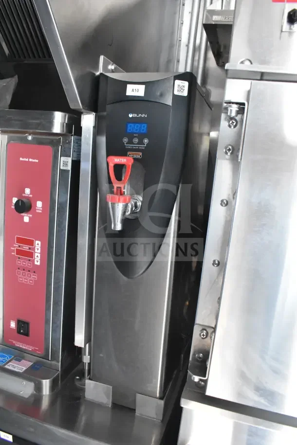 2021 Texino food trailer interior, featuring a Bunn hot water dispenser, red controls, and stainless steel surfaces.