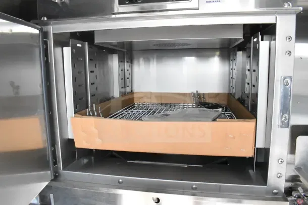 2021 Texino food trailer interior showing stainless steel shelves and CaptiveAire system setup.