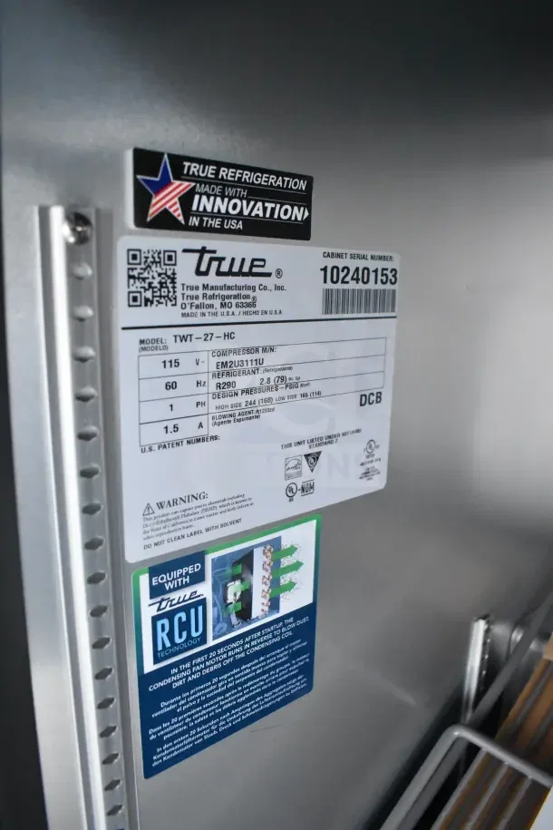 Label on True refrigeration unit in Texino food trailer, model TWT-27-HC, featuring True RCU technology and compressor details.